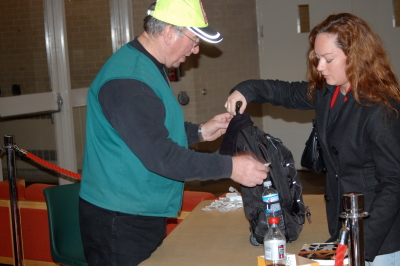 Security Officer checks in a Sinclair student's book bag. --photo by Kamari Stevens