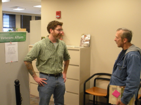 Jimmy Ryan (left) talks with Army veteran and prospective student Richard Bartlett. Ryan is a student counselor for the Veteran's Assistance office, located in Building 10, Room 324. --photo by Rusty Pate