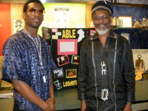 Bakari Lumumba and Dr. Boikai Twe helped organize the Malcolm X community forum held on Friday, May 22, in the basement of Building 8.