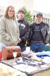 Tina Porter, Doug Hubbard and Kristopher Sumrall stand behind the Alternative Religions table at the Safety Awareness Expo on Sept. 30.  Hubbard is the advisor to the prospective club. 