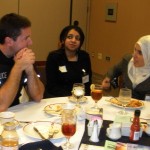 Officer Alan Brown speaks with Sinclair students Furhah Ali and Widad Boussaha during the Muslim Student Assocation Welcome Luncheon on Oct. 29.