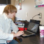 Sinclair student Bobby Belvo uses his laptop in the Tartan Main Street Cafe in Building 10.  "This is by far the quickest reception I've gotten so far (on campus)," he said.